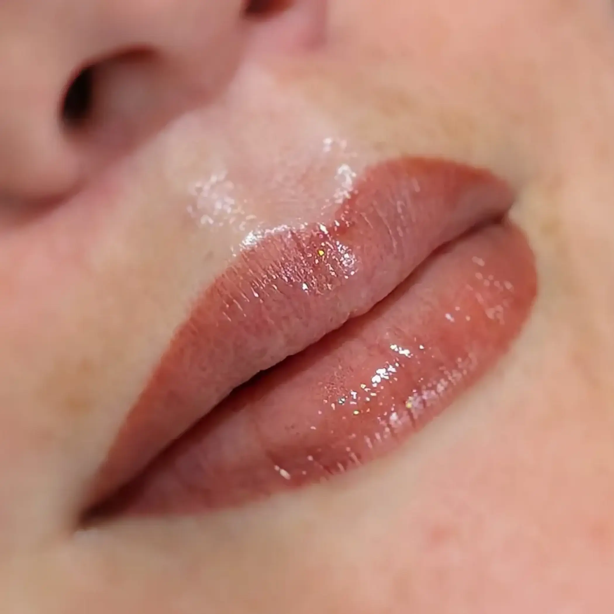 close up lip tattoo needle detail