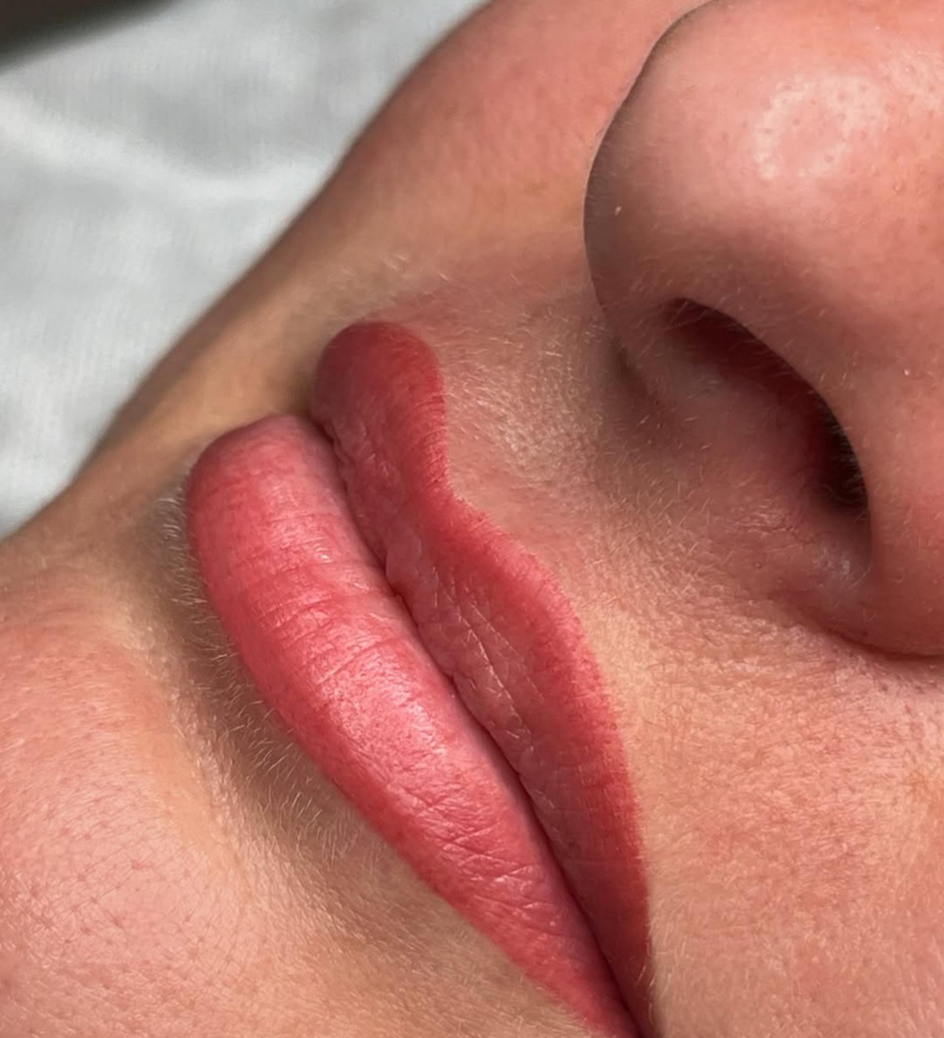 close up warm coral lip pigment