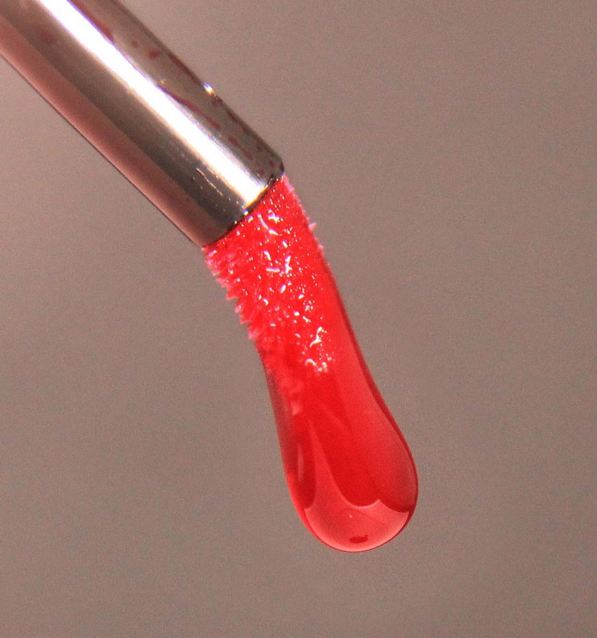 technician applying permanent lip makeup